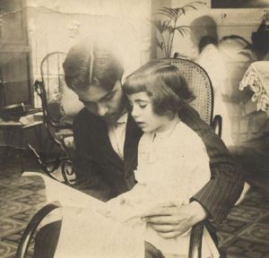 Federico teaching his little sister Isabel to read.
